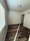Room 1 with 1/2 bath - 1829 31st St Apartments Unit B