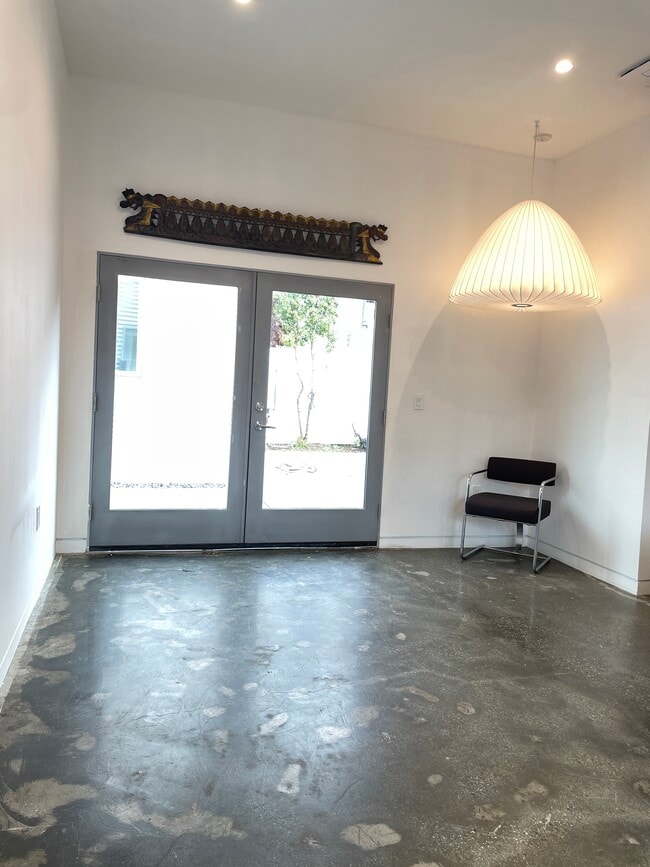 Living space with french doors to patio - 2725 Dalton Ave Unit 1.5