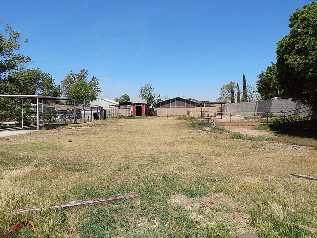 Photo - This property is a 3 bedroom, 2 bathroom home featuring an open floor plan with tile throughout. ...