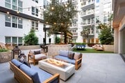 Gather around a firepit under sparkling string lighting in one of two stunning courtyards at Modera San Diego - Modera San Diego