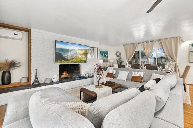 Step into comfort! Our cozy living room is perfect for relaxation together. - 4989 Randlett Dr