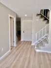 Hallway to stairs and front of home - 11266 Fripps Way