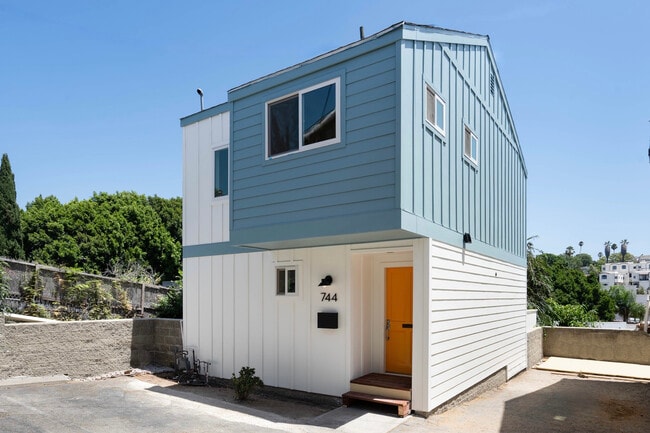 Exterior of townhouse. Two tandem parking spaces pictured on right side of photo. - 744 N Dillon St Townhome