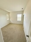 Photo - Charming 3BR Home with Modern Kitchen, Versatile Loft, & Private Backyard