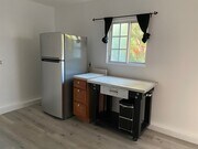 Window overlooks patio with fruit trees - 5029 Douglas Ln Unit Garage Studio