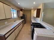 Kitchen includes newer appliances, gas range and refrigerator with ice maker. - 1450 E Granvia Valmonte