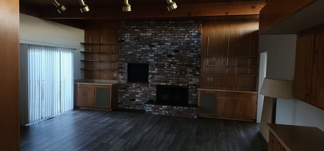 Photo - This is a spacious house featuring four bedrooms and two bathrooms, along with a two-car garage.