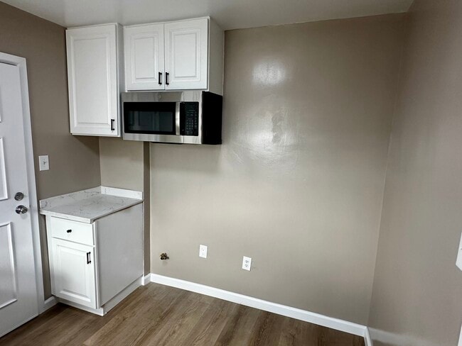 Updated kitchen with new over the range microwave. - 2132 W 104th St Unit 2132