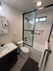 Remodeled bathroom with shower head water filter - 630 E San Antonio Dr Apartments Unit #1