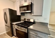 Kitchen w/New Premium Appliances - Corteen Place Apartments