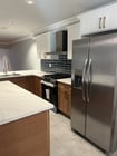 White Oak kitchen with quartz countertops - 6221 Monterey Rd Unit East