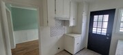 Kitchen looking out tords dining room/ balcony - 11683 Chandler Blvd Apartments
