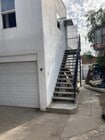 Stairs leading to unit. - 1526 E Wilson Ave Unit Studio Apartment