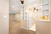 view looking at living room with front door in distance - 1317 19th St Apartment Unit C