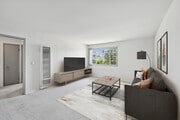Living room with carpet - AVA Newport Apartments