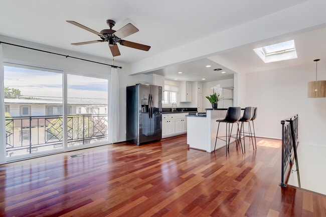 Spacious great room with open kitchen and balcony. - 744 12th St Unit 744 12th St