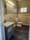One of 2 full baths - 10609 S Main St Apartments Unit Main street