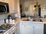 Kitchen towards dining area and office nook. - 6020 Seabluff Dr Condo Unit 417
