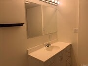 Bathroom vanity & mirror - 5820 Calvin Ave