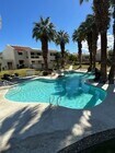Large main swimming pool with palm trees! - 255 E Avenida Granada Unit #725