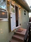private entance behind gate - 4244 58th St Apartment Unit 1