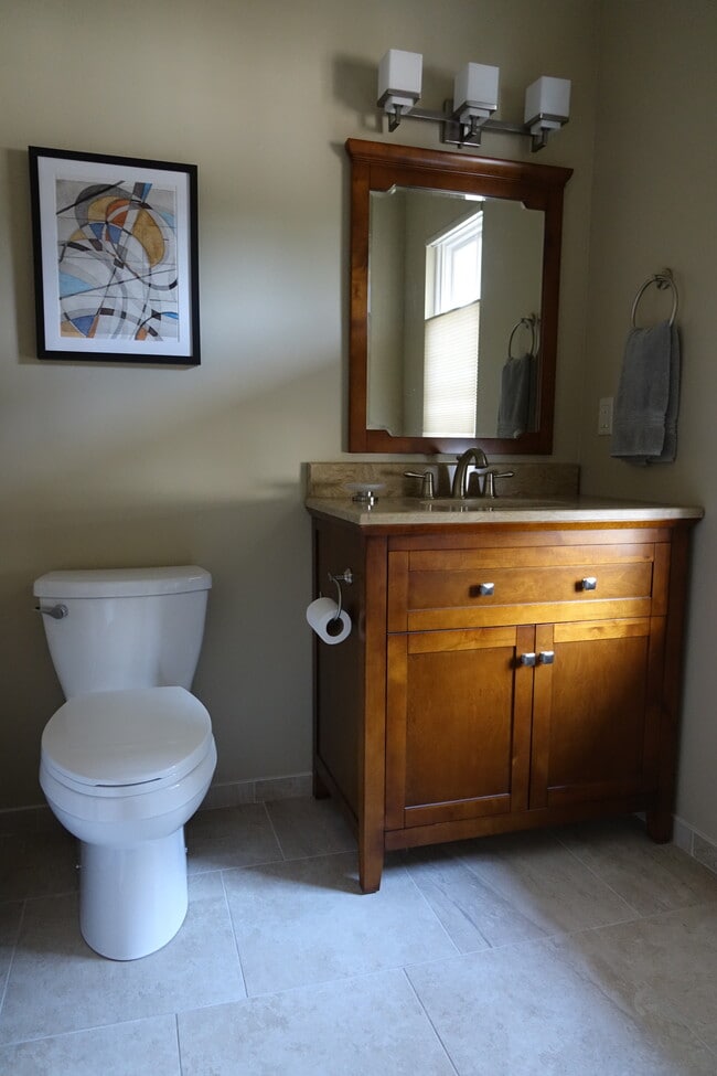 Full-size bathroom with vanity and over-sink mirror - 2620 Tallant Rd Unit Guest House