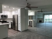 Kitchen w/ reflection of living room - 5665 Friars Rd Unit 226