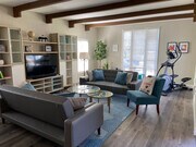 Furnished living room w/elliptical. - 1104 S Hayworth Ave House