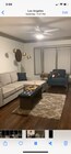 Living room couch opens up to a sleeper - 3622 W Adams Blvd Apartment Unit 1