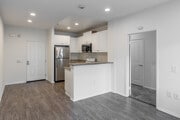 1BR, 1BA - 575SF - Living Room, Kitchen - Harbor Grove Apartments
