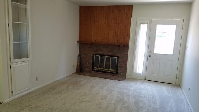 living room with fire place - 16845 Armstead St Unit apartment