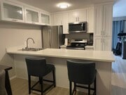 kitchen with large counter, dishwasher, fridge/freezer, oven, stovetop, microwave - 5051 La Jolla Blvd Unit 101