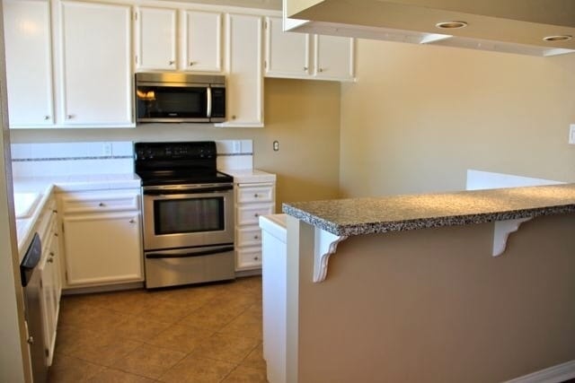 Photo - COMING SOON - 3 bed, 2 bath Townhouse with attached 2 car garage ready to move in!! Unit 267