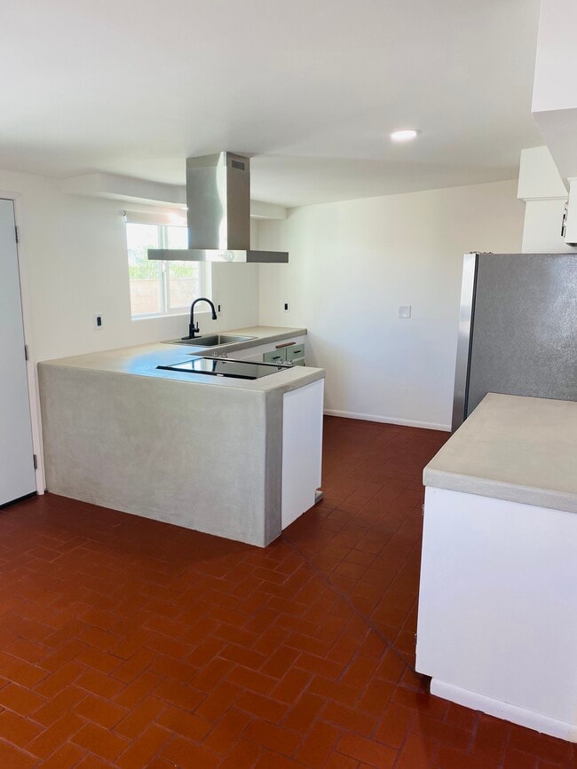 View of open concept kitchen from dining area - 6393 Desert Queen Ave