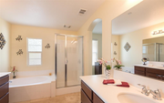 Master bathroom with two separate sinks, plus shower enclosure and separate bathtub - 1406 Mosaic Glen House
