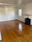 Large living room with hardwood floors and firelplace - 1416 Ellsmere Ave Unit 1416 Ellsmere Ave