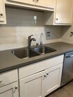 Tile added to kitchen backsplash - 1119 E 15th St Apartments Unit #1119