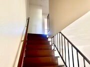 View upstairs to bedrooms with full bathroom and closet - 619 W Provential Dr Unit Apt B