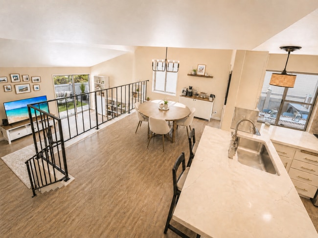 Kitchen, Dining Room, and TV Room - 8775 Gilman Dr Unit D