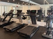Fitness Center With Treadmills, Free Weights, and Bikes. - Clarington Court