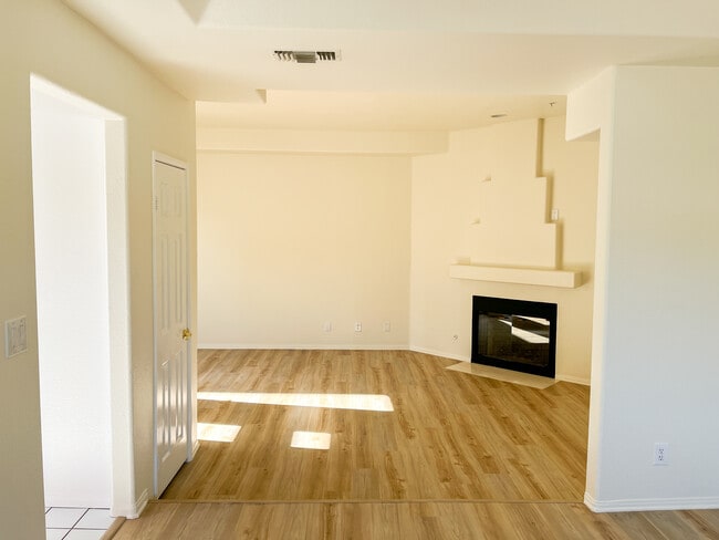 Large, sunny living room with fireplace - 10626 Valley Spring Ln Unit 304
