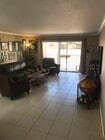 Living room, fresh paint and new baseboards throughout - 1335 Newport Ave Unit 205