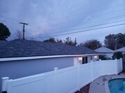 ADU is located behind the garage. No part of the garage is the ADU. - 7650 Ostrom Ave