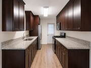 remodeled kitchen with stainless steel stove, washer/dryer and refrigerator - 4091 Rosecrans Ave