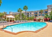 Pool Deck with Lounge Chairs and Cabanas - The Lorenzo Apartments