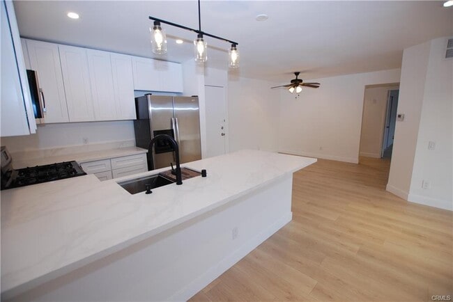 Building Photo - 6820 Remmet Ave Unit 304