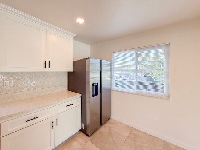 Photo - Renovated Triplex with Private Yard, AC, and Parking