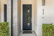Front door featuring keyless entry door. - 215 Elm Ave