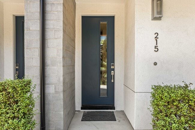Front door featuring keyless entry door. - 215 Elm Ave