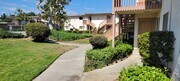 Gardens around apartment enterences at Plaza Verde Apartments in Escondido, California. - Plaza Verde Apartments